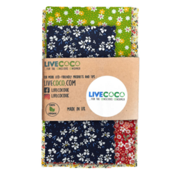  Reusable vegan eco food wraps in a pack of 4, featuring a floral pattern in green, yellow, and navy blue colors. The wraps are made of sustainable materials and can be used to store food.