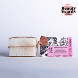 Handmade geranium and palmarosa soap bar with natural ingredients and floral scent.