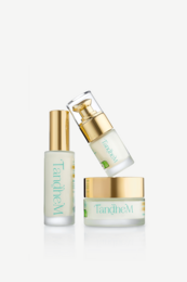 White cream jar with gold cap, skincare set, luxury face treatment, three-step routine, moisturizer serum