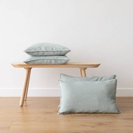 Linen cushion cover in sea foam terra color with fringe trim. Available in various sizes including 30x40 cm, 30x50 cm, 40x60 cm, and more. Rectangular shape with soft, textured linen material.