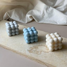 Set of 3 cream, light gray, and light blue bubble candles in a variety of shapes and sizes.