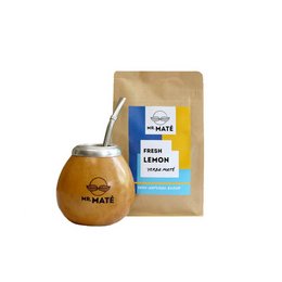 Yerba mate tea set with calabaza gourd, bombilla straw, and lemon mint flavored yerba mate leaves. The set includes a traditional calabaza gourd, a metal bombilla straw, and a 150g package of lemon mint flavored yerba mate leaves.