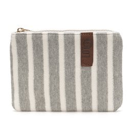 Soft, plush makeup pouch in a creamy white color with a circular logo detail.