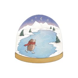  A Christmas card featuring a hedgehog in a snowy winter scene with a crescent moon and pine trees. The card has a round, snow globe-like design.