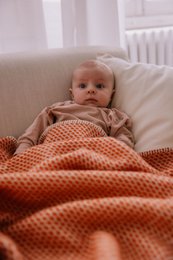  Cozy retro orange wool crib blanket, perfect for keeping baby warm and snug.