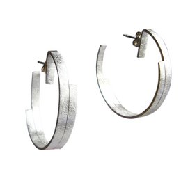 Silver hoop earrings with a sleek, modern design. The hoops have a brushed metallic finish for a stylish statement look.