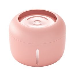 Stylish pet fountain in a pink color, designed for pets. Features a circular shape and a water dispenser for providing fresh water.
