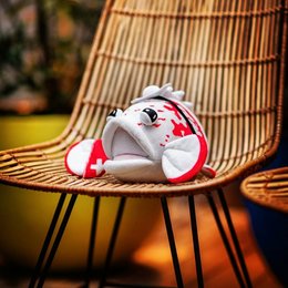 Soft, cuddly plush toy in the shape of a grouper fish with red accents. Ideal for children's playtime or as a decorative accent.