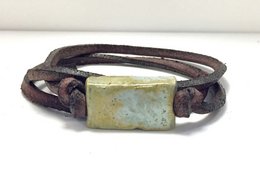 Antique green ceramic block bracelet on leather lace. Rectangular ceramic block with distressed finish. Leather lace in dark brown color. Casual, rustic style.