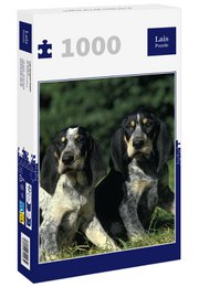 A 1000-piece puzzle featuring two Petit Bleu de Gascogne dogs in a natural outdoor setting. The dogs have black and white coats and are standing together in a grassy field.
