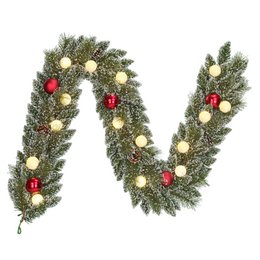  Lush green Christmas wreath with warm white LED lights, red and gold ornaments, and pine cones. Ideal for holiday decor.