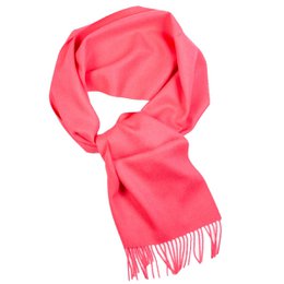  Soft, warm alpaca wool scarf in a vibrant rose color with long fringes along the edges.