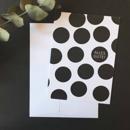 A folding birthday card with a bold black and white polka dot pattern. The card is simple and minimalist in design, with the text "All the best" printed on the front.