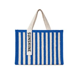  A blue and white striped tote bag with the word "Sunshine" printed on it. The bag has a beige rope handle.
