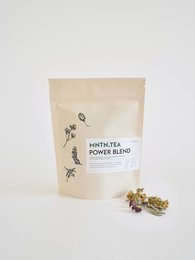 A resealable pouch containing a blend of white tea and power herbs. The pouch has a simple, minimalist design with text indicating the product name "POWER BLEND" and the contents "WHITE TEA POWER BLEND".