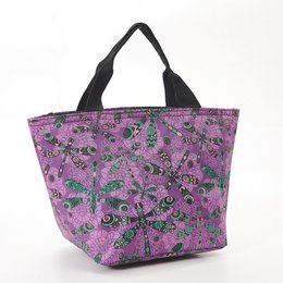 Insulated lunch bag with dragonfly print in purple and teal colors, made of eco-friendly materials.