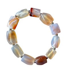  Multicolored agate bracelet with large natural stones, suitable for casual or formal wear.