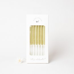  Gold birthday candles, tall and cylindrical in shape, made of wax material.