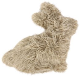 Soft, plush, and furry beige cushion with a cozy, textured appearance.