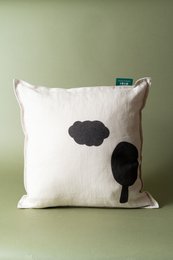  "Cream linen cushion with black cloud and tree silhouette design, minimalist home decor"