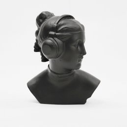 Monochrome bust sculpture of a female figure wearing headphones, with a stylized, abstract design.