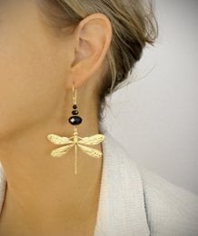Gold dragonfly earrings with black crystals, statement earrings with intricate gold dragonfly design and black crystal accents.