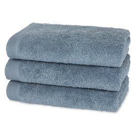 Gray, plush bath towels made of soft, absorbent cotton material.