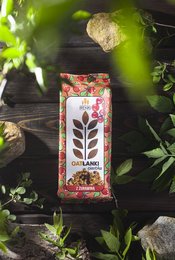 Oatmeal cookies with cranberry, 150g. Colorful packaging with leaf and berry design. Cookies contain oats and cranberries.