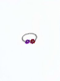 Silver ring with purple and red beads, suitable for wedding or special occasions.