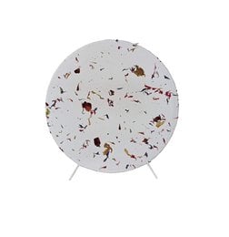 A round, white table lamp with flecks of red and brown throughout the design. The lamp has a modern, minimalist style and appears to be made of a durable, sustainable material.