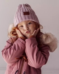 A cozy, ribbed-knit hat in a deep blue color, perfect for keeping little heads warm. Features a small leather patch with the brand logo.