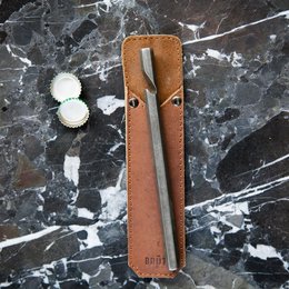 Bottle opener with leather sleeve, made by Brut Homeware. Durable leather sleeve, compact design, suitable for opening bottles.