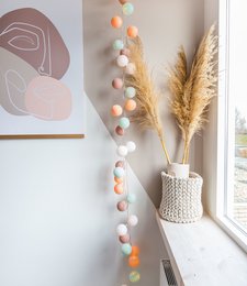 Colorful string lights with macaron-shaped bulbs, available in various lengths. Includes an adapter for easy setup.