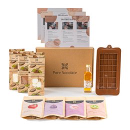 Set of ingredients for making chocolate yourself, including chocolate bars, toppings, and a chocolate mold. The product is suitable for chocolate gifts.