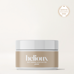  Creamy, moisturizing self-tanning body butter in a white jar with the Helioux brand name.