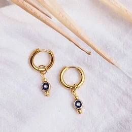 Gold-tone hoop earrings with navy blue beads, creating a statement look.