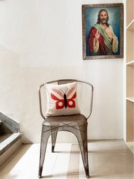 Soft cotton knit pillow cover with punchneedle embroidered butterfly design in pink, red, and black. Available April 1st.