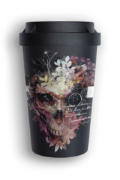 A black travel cup with a floral skull design. The cup has a black lid and appears to be made of a durable material, likely ceramic or plastic. The design features a skull surrounded by colorful flowers and foliage against a dark background.
