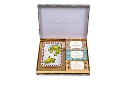  A pink box containing 3 decorative soaps with a floral pattern on the box.