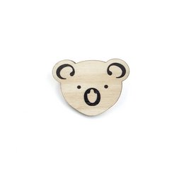 Wooden brooch in the shape of a cute koala face with black accents. Suitable for casual or formal wear.