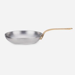 Stainless steel frypan with cast brass handle, suitable for cooking on the stovetop.