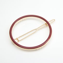 Round hair clip made of various materials including Blanc, Nude, Mousse, Ambre, Brique, Midnight Blue, Sans Email, Prusse, Corail, Aniline, Sable, and Massaï.