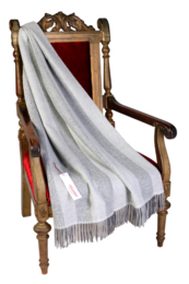  A cozy, greyish plaid throw blanket made of soft alpaca wool with a herringbone pattern.