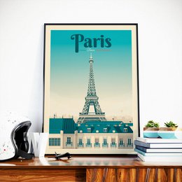 Vintage Paris Eiffel Tower poster featuring the iconic landmark against a turquoise sky. The poster showcases the classic Parisian architecture and style.