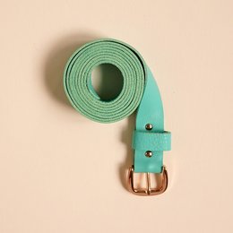 Mint green leather belt with aniline finish, suitable for casual and formal wear.