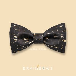 Black bow tie with a shimmering, speckled pattern resembling a starry night sky. Suitable for formal occasions and events with a vintage or art deco theme.