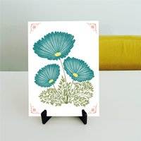 Toffe tegel met petrol kleurige bloemen en roze details