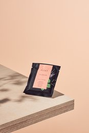 Tea sachet BLOSSOM, case of 50pcs. Floral-patterned tea sachets in a black box. Includes details on color, material, and style.