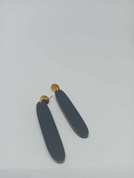  Black matte acrylic drop earrings with gold accents.