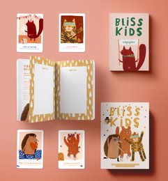 Colorful illustrations of playful cats on a variety of products, including books, cards, and packaging. The cats have a whimsical, cartoon-like style and appear to be the focus of the "Bliss Kids" product line.